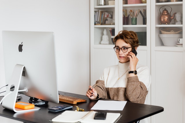 Serious-looking businesswoman on her phone